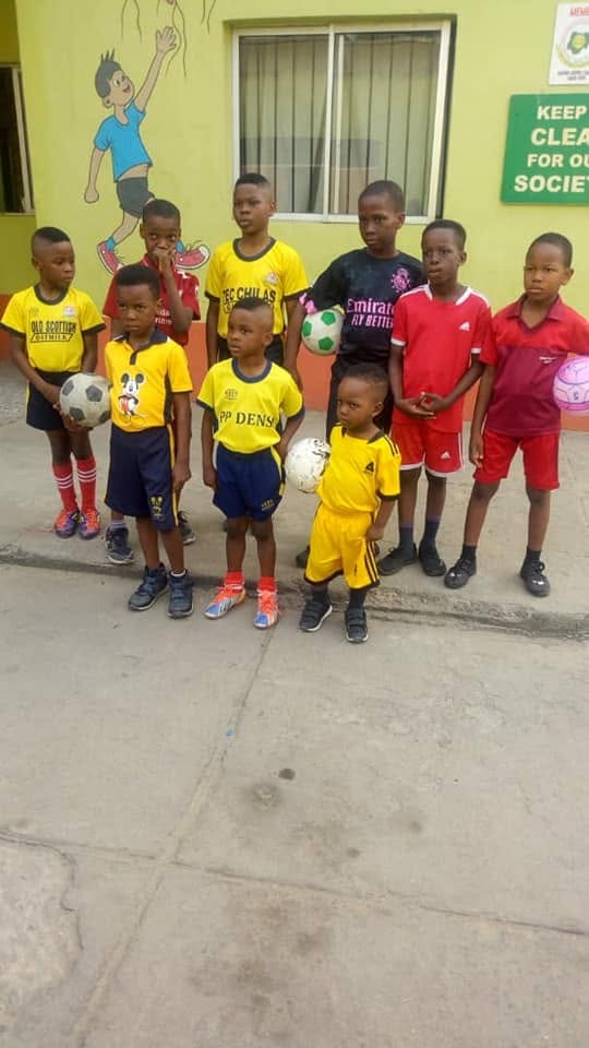 School football squad with footballs